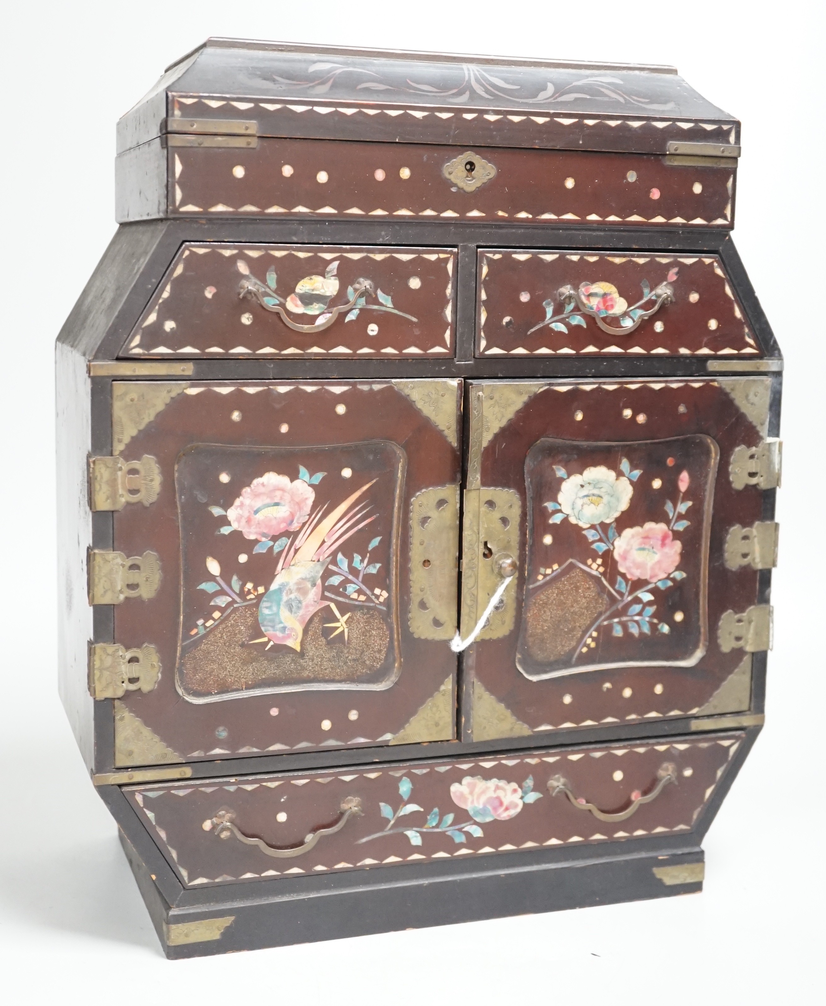 A Japanese inlaid mother-of-pearl miniature chest. 36cm tall